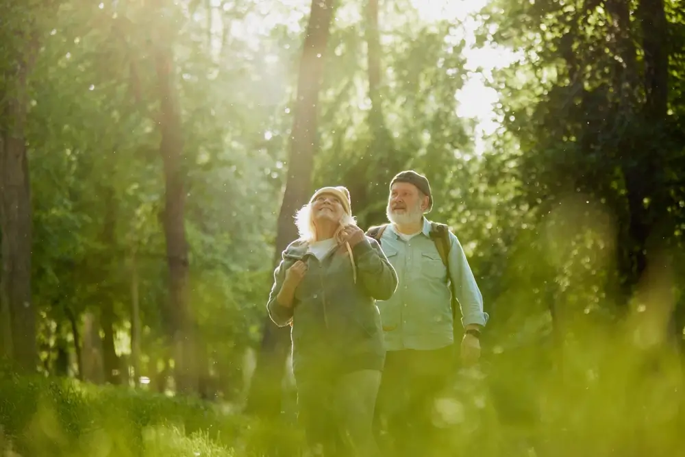 Senior,Couple,,Man,And,Woman,Taking,Peaceful,Walk,In,Park,